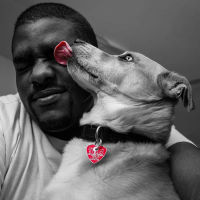 Dog licking mans face